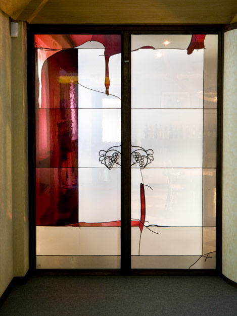 Mouth blown glass doors of the office.